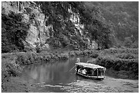 Shallow boats transport villagers to a market. Northeast Vietnam (black and white)