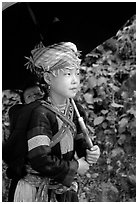 Hmong girl sheltering herself and her younger sibling with an unbrella, between Lai Chau and Tam Duong. Northwest Vietnam ( black and white)