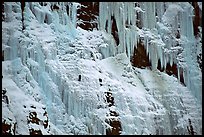 Wide frozen waterfall called Weeping Wall in early season. Banff National Park, Canadian Rockies, Alberta, Canada (color)