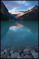 Boulders, Lake Louise, and Victoria Peak, sunrise. Banff National Park, Canadian Rockies, Alberta, Canada (color)
