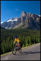 Cyclist on the road to the Valley of Ten Peaks. Banff National Park, Canadian Rockies, Alberta, Canada (color)