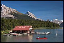 Boat house and canoe beneath Leh and Samson Peaks,  Maligne Lake. Jasper National Park, Canadian Rockies, Alberta, Canada (color)