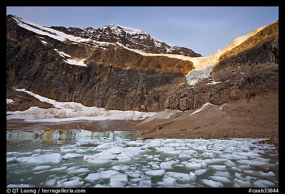 Glacial Pond filled with icebergs below Mt Edith Cavell, sunrise. Jasper National Park, Canadian Rockies, Alberta, Canada