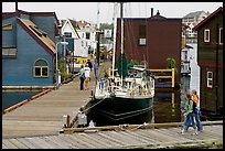 Houseboats, deck, and sailboat, Upper Harbour. Victoria, British Columbia, Canada (color)