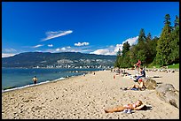 Woman sunning herself on a beach, Stanley Park. Vancouver, British Columbia, Canada (color)