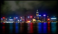 Colorful reflections of Hong-Kong Island lights across the harbor by night. Hong-Kong, China