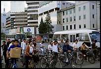 Bicyclists waiting for traffic light. Kunming, Yunnan, China (color)