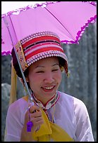 Woman from the Sani branch of the Yi tribespeople with a sun unbrella. Shilin, Yunnan, China
