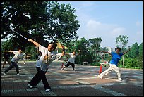 Collective exercise gymnastics with swords,  Liuha Park. Guangzhou, Guangdong, China (color)