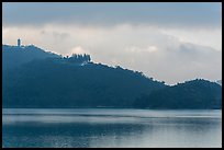 Shabalan Mountain ridge in mist with Syuanzang Temple and Tsen Pagoda. Sun Moon Lake, Taiwan (color)