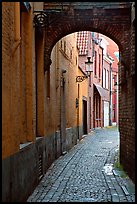 Narrow cobled street and archway. Bruges, Belgium ( color)