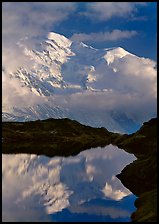 Mont Blanc and clouds reflected in pond, Chamonix. France