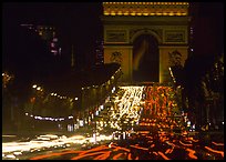 Arc de Triomphe and Champs Elysees at night with car light trails. Paris, France
