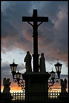 Cross and statues with sunset clouds. Avignon, Provence, France ( color)