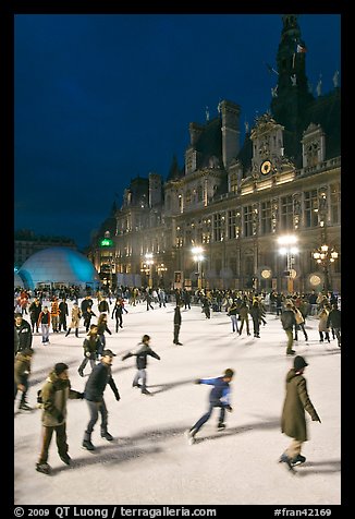 Holiday ice ring, City Hall by night. Paris, France (color)
