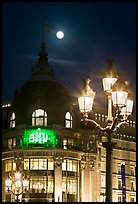 Street lamps, BHV department store, and moon. Paris, France (color)