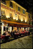 Restaurant with outdoor sitting by night, Montmartre. Paris, France (color)