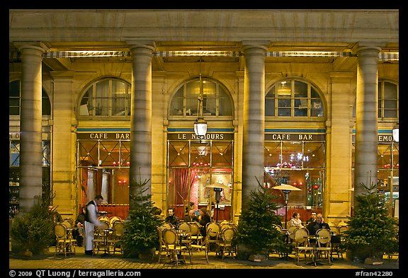 Arcades and Cafe by night. Paris, France