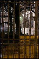 Cluny thermes behind iron grids by night. Quartier Latin, Paris, France (color)