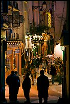 Pedestrian street with restaurants at night. Quartier Latin, Paris, France