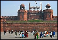 Tourists walking on esplanade in front of the Lahore Gate. New Delhi, India (color)
