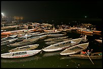 Boats on the Ganges River at night during arti ceremony. Varanasi, Uttar Pradesh, India (color)