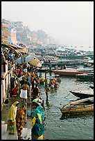 People and boats on the banks of the Ganges River, Dasaswamedh Ghat. Varanasi, Uttar Pradesh, India (color)
