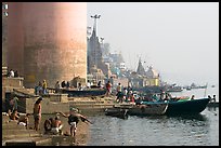 Ganges riverbank with men bathing. Varanasi, Uttar Pradesh, India