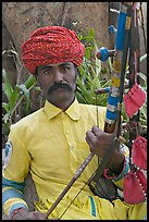 Musician with string instrument. Agra, Uttar Pradesh, India (color)