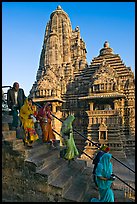 Worshipers going down stairs in front of Lakshmana temple. Khajuraho, Madhya Pradesh, India (color)