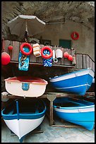 Tiny fishing boats stacked in the main square, Riomaggiore. Cinque Terre, Liguria, Italy