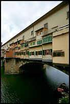 Ponte Vecchio bridge covered with shops, spanning  Arno River. Florence, Tuscany, Italy (color)