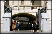 Nuns move past checkpoint manned by Swiss guards. Vatican City (color)