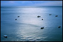 Small boats at sunset in the Gulf of Salerno, Positano. Amalfi Coast, Campania, Italy