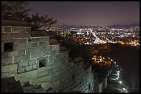 Rampart wall and city lights, Suwon Hwaseong Fortress. South Korea ( color)