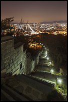 Path, wall, and city lights, Suwon Hwaseong Fortress. South Korea ( color)