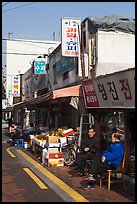 Shopkeepers and storefronts. Daegu, South Korea (color)
