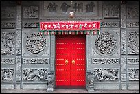 Red door and slate carved wall, Hainan Temple. George Town, Penang, Malaysia ( color)