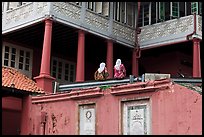 Stadthuys detail with two women. Malacca City, Malaysia (color)