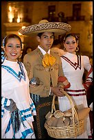Man with sombrero hat surrounded by  two women. Guadalajara, Jalisco, Mexico (color)