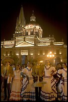 Men and women in traditional mexican costume with Cathedral in background. Guadalajara, Jalisco, Mexico (color)
