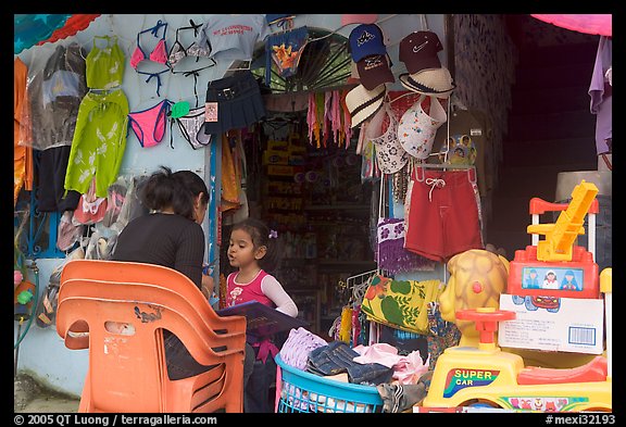 Woman and girl outside a store,  Boca de Tomatlan, Jalisco. Jalisco, Mexico