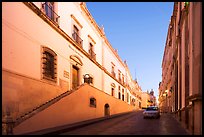Car in street at dawn with Zacatecas Museum. Zacatecas, Mexico (color)