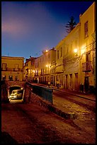 Juarez street and subterranean street with bus at night. Guanajuato, Mexico (color)
