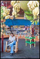 Woman sitting in a fruit stand. Mexico (color)