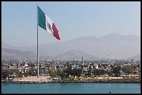 Giean Mexican national flag flying above Malecon, Ensenada. Baja California, Mexico (color)