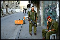 Two young israeli soldiers manning a checkpoint, Hebron. West Bank, Occupied Territories (Israel) (color)