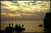 Fishermen standing on a rock, Akko (Acre). Israel (color)