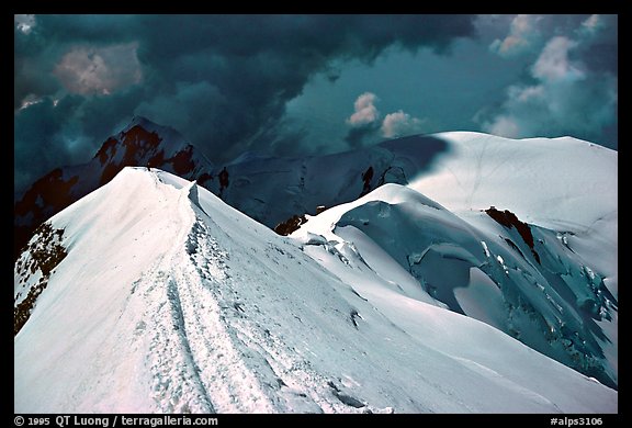 Summit ridge of Mont-Blanc and Bosses ridge with climber's trail in the snow, France and Italy.  (color)