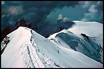 Summit ridge of Mont-Blanc and Bosses ridge with climber's trail in the snow, France and Italy.